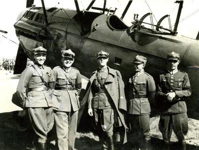 Polish military pilots in front of a plane on the airfield in Sknyliv