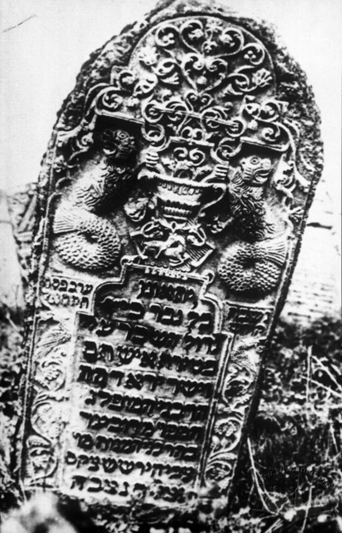 Baroque tombstone with allegorical relief in old cemetery 2