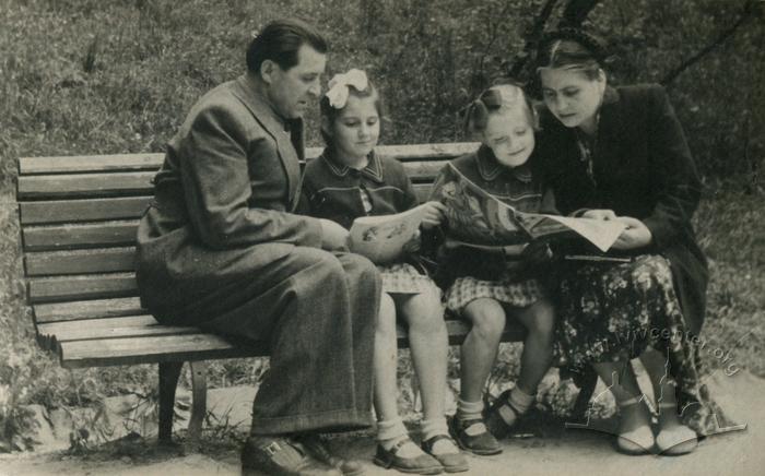 Family resting in a park 2