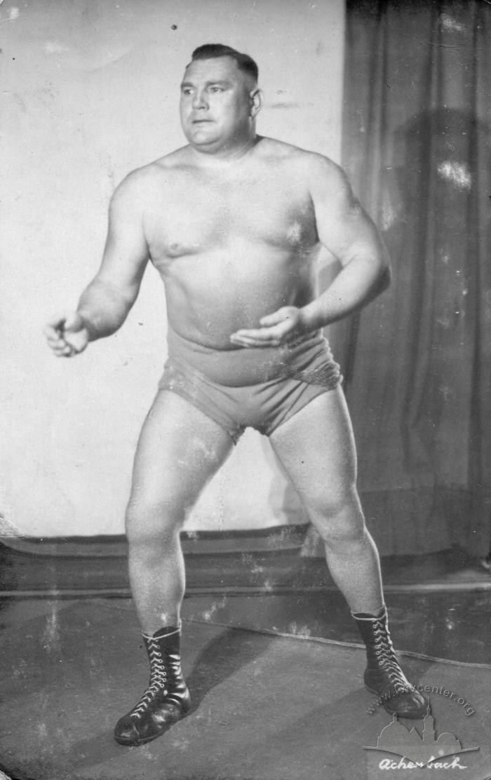 Wrestler in stance poses for an advertising photo 2