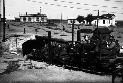 Workers descending into the mine