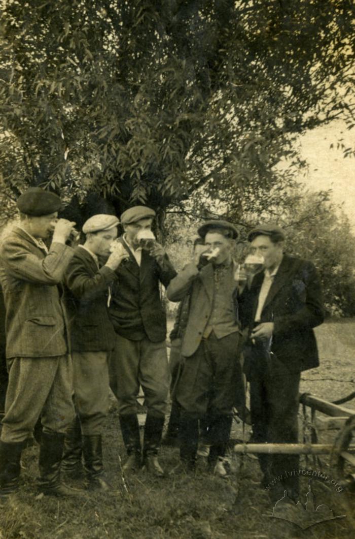 Group of men savor hops drink 2