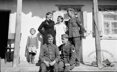 Portrait of German Soldiers with Local Citizens