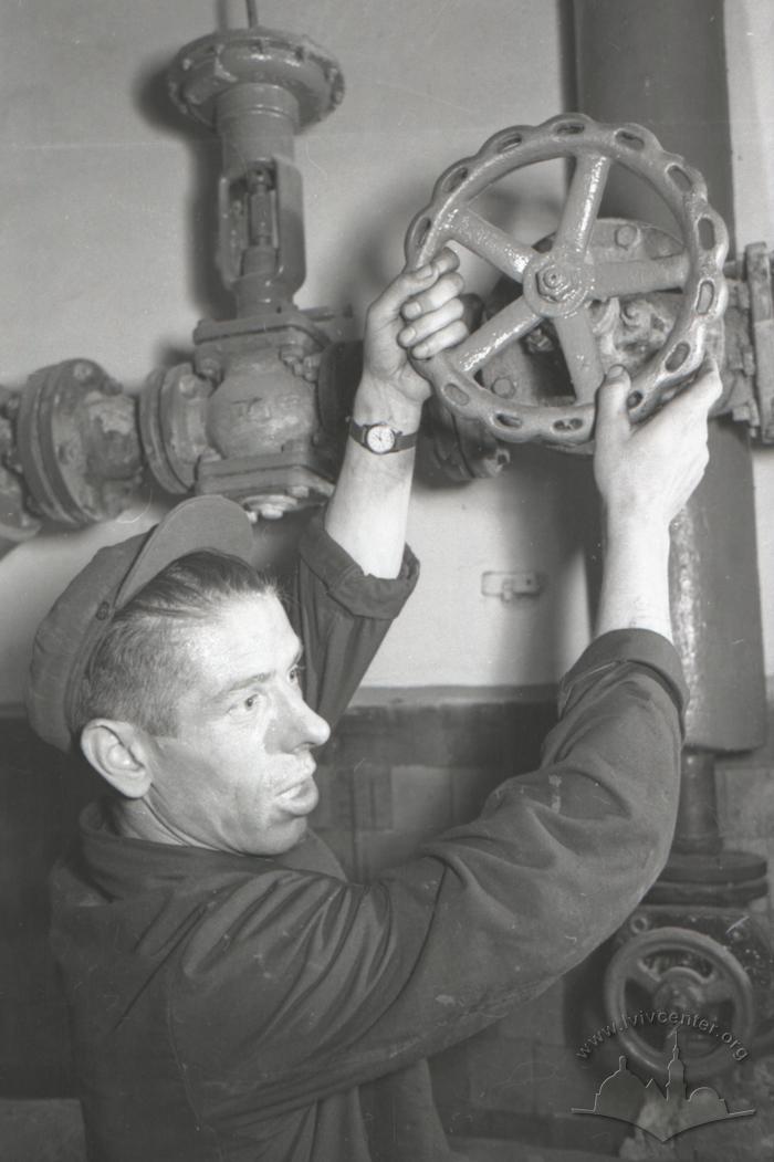 Coke-chemical plant. Employee of the control and measuring devices workshop V. Moltopar checks new samples. Motor mechanic of the control and measuring devices workshop A. Prusova 2