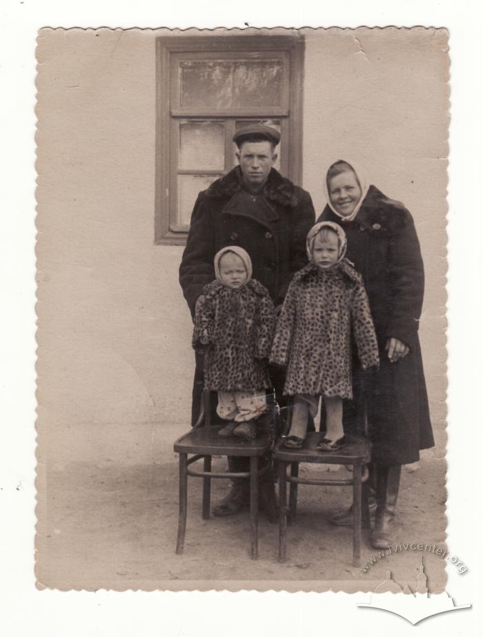 Family with children in their yard 2