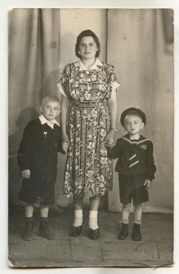 Studio photo of a woman with two children 2