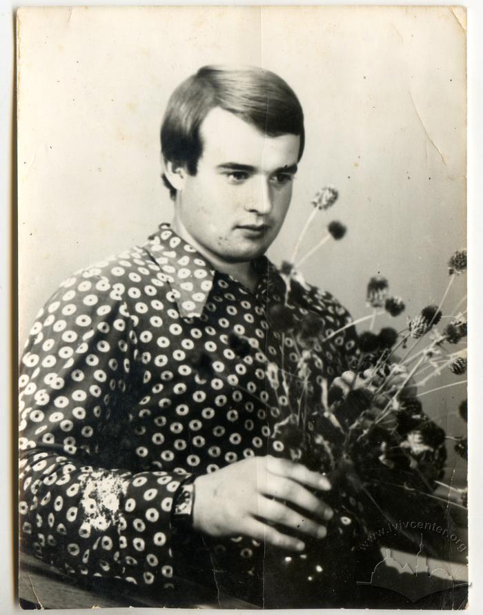 Young man with dry flowers 2