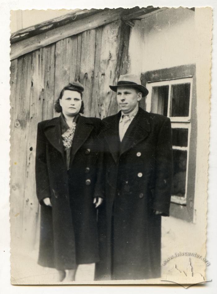 Woman and man wearing coats 2