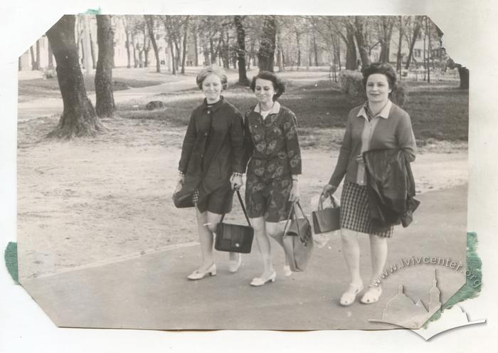 Three women walking down the street 2