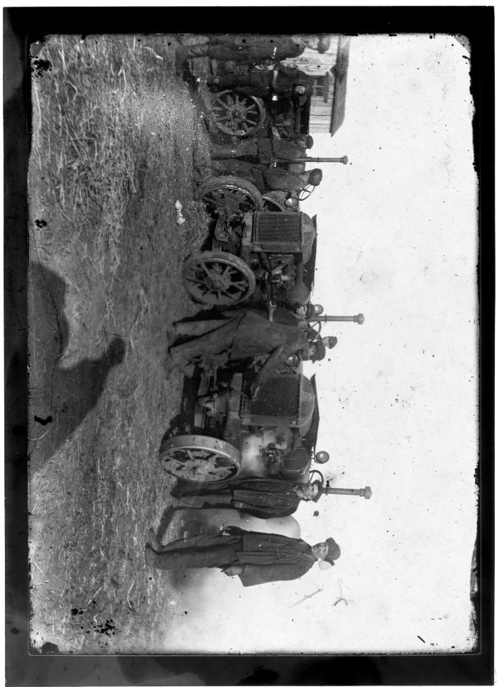 Men near agricultural machinery 2