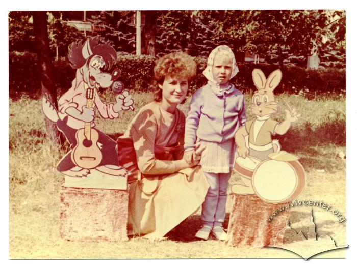 Tanya with her daughter near the cartoon characters 2
