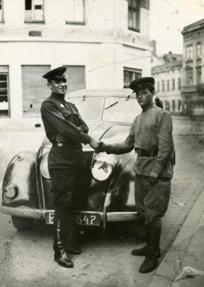 Military Men Next to a Trophy Car 2