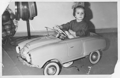 Behind the wheel of a children's Moskvitch