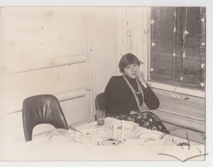 Portrait of a woman at a table 2